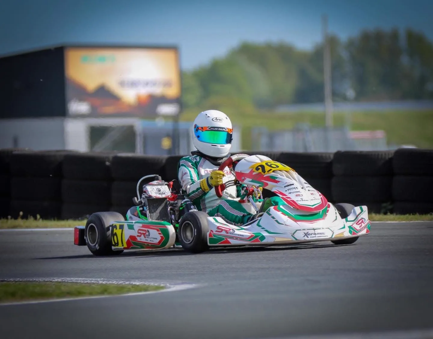 SR Solutions kart through a corner in the sun